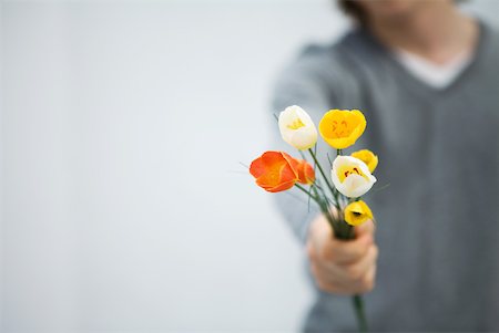 Holding out some flowers